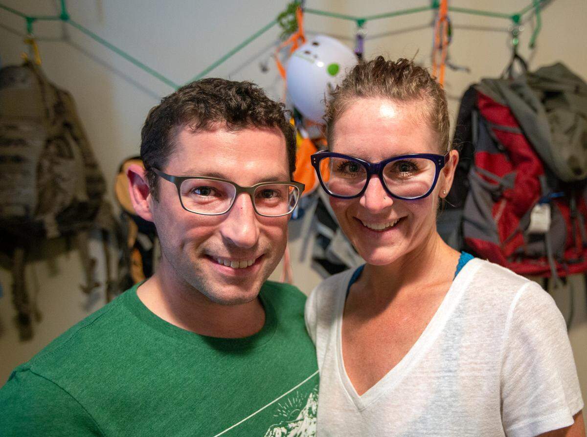 Ross Craig and CJ Shane inside their hiking gear room at home. They recently summitted Mt Rainier on July 14.