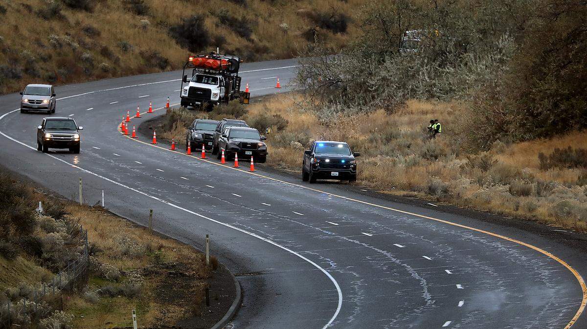 Investigators from the Washington State Patrol document the scene were a person was found dead in the median of eastbound Highway 240 to Interstate 182 in Richland.
