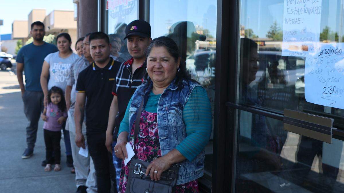 People wait in line for an appointment with the mobile Mexican Consulate at 1828 Lewis Street in Pasco.