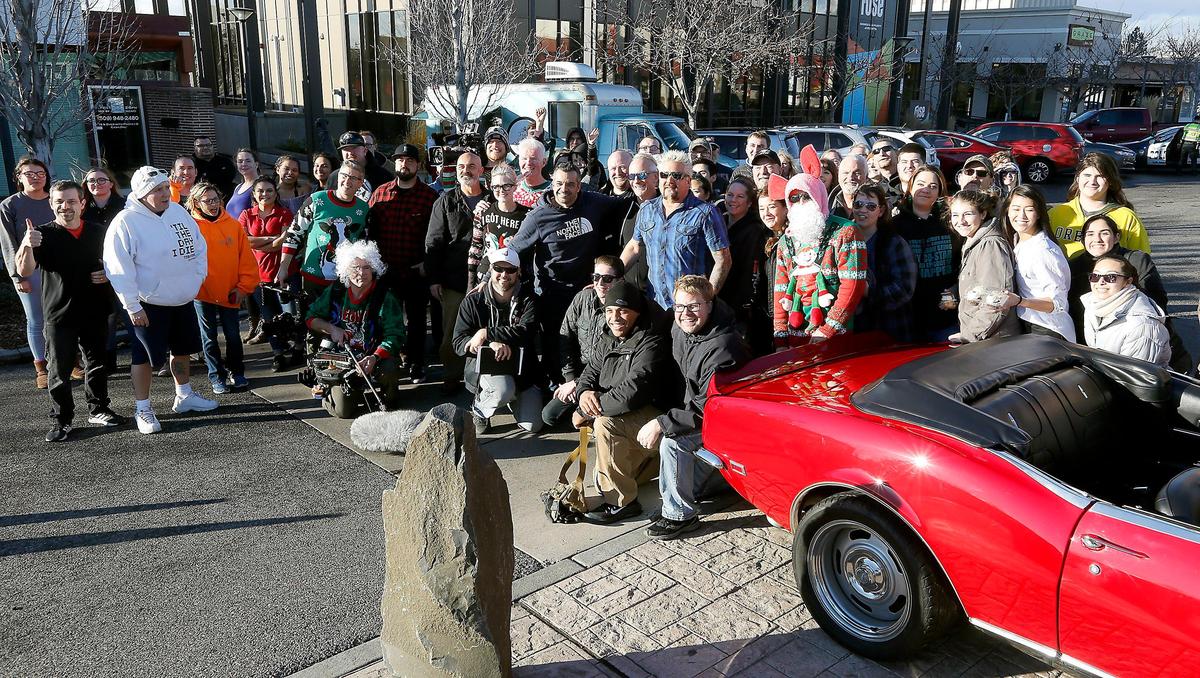Chef Guy Fieri is surrounded by crew members and fans gathered Tuesday in The Parkway in Richland for recordings of his Food Network television show, Diners, Drive-Ins & Dives.