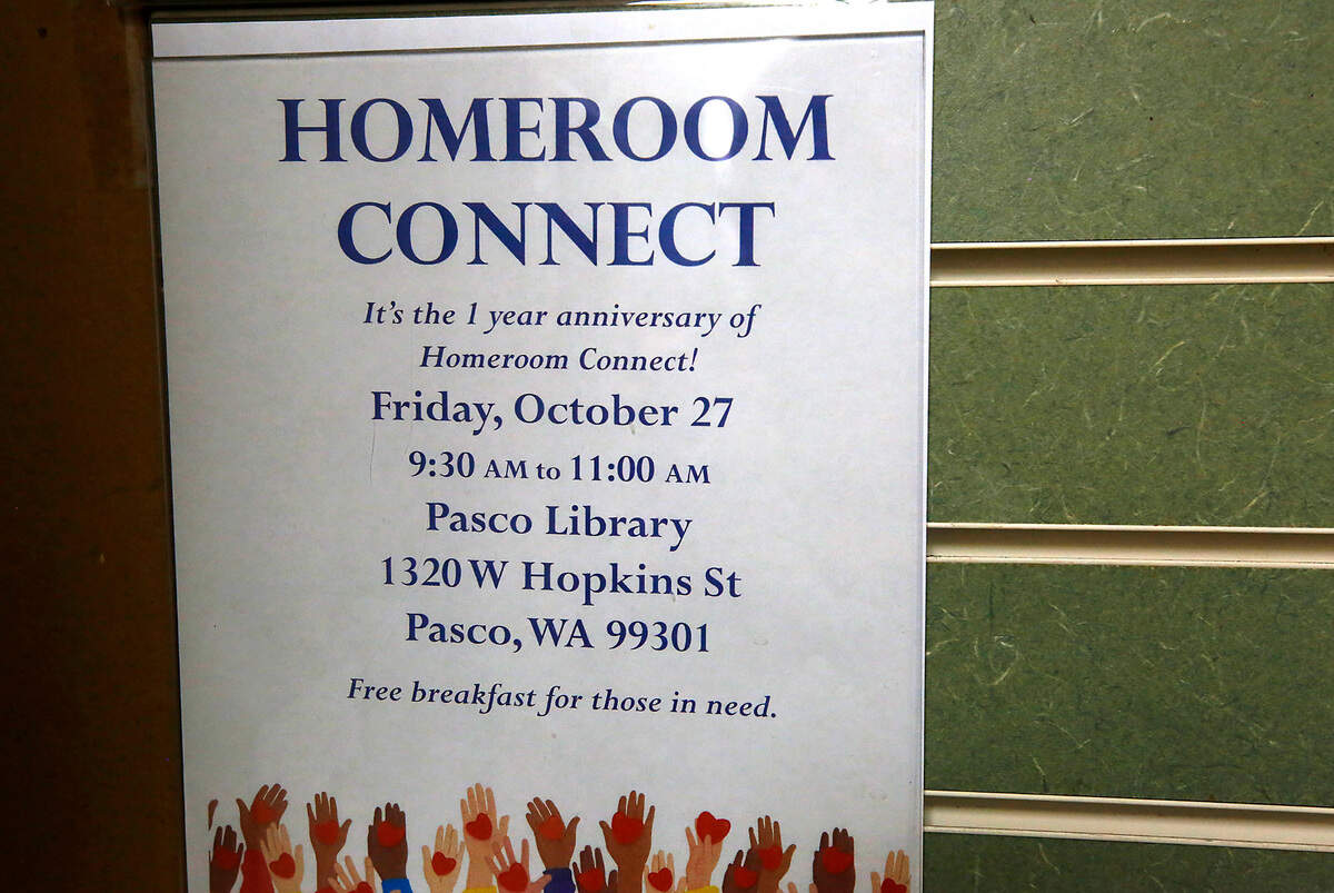 A poster displayed in the lobby of the Pasco branch of the Mid-Columbia Libraries announces the first anniversary of the Homeroom Connect program.