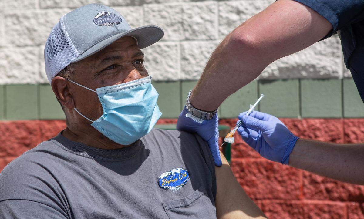 Mel Phynon, 59, of Oregon, was delivering fuel to a gas station across the street from Fiesta Foods when he saw the signs for free vaccines. “Since I’m here and got some time, I might as well go,” he said.