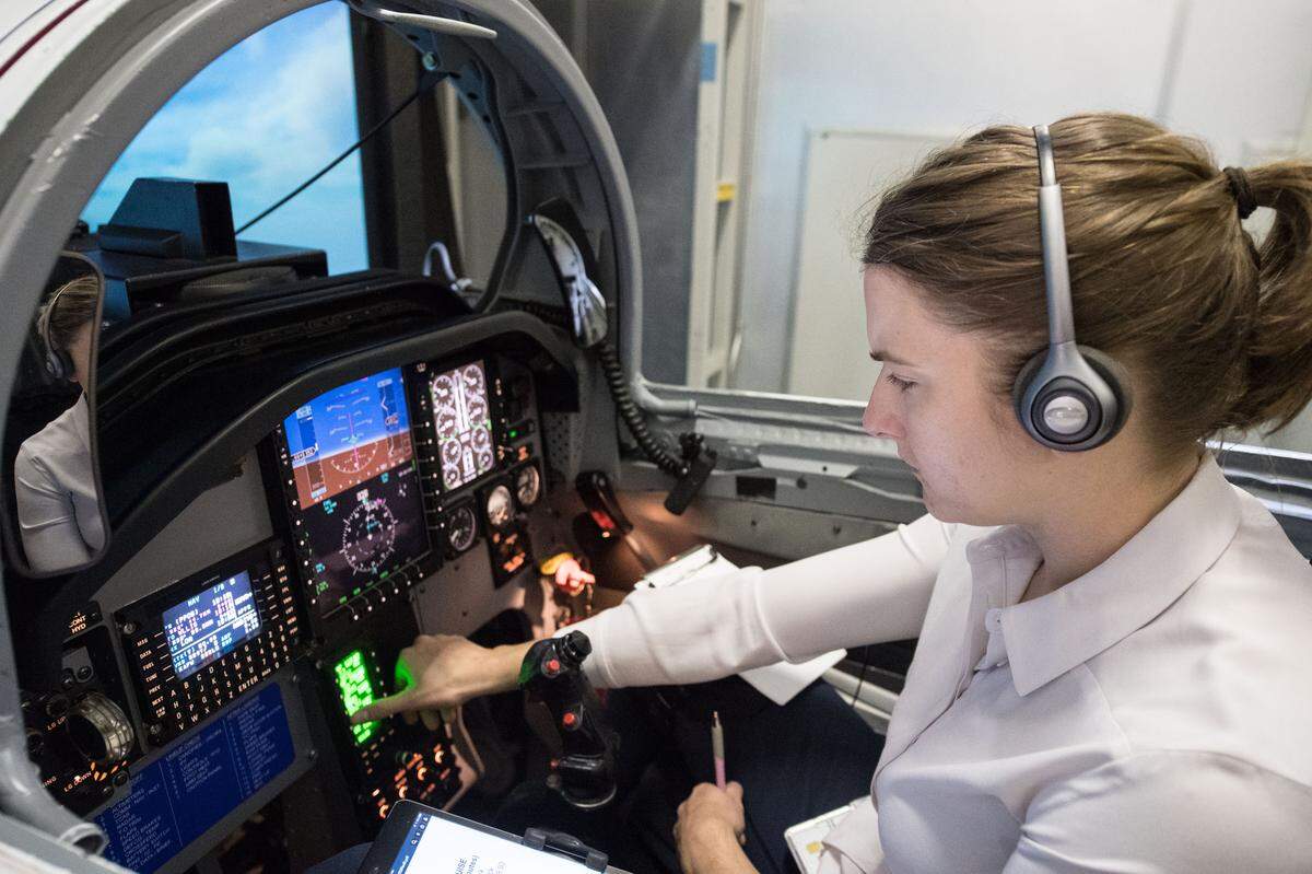 NASA astronaut Kayla Barron practices procedures during T-38 flight simulator training in Houston.