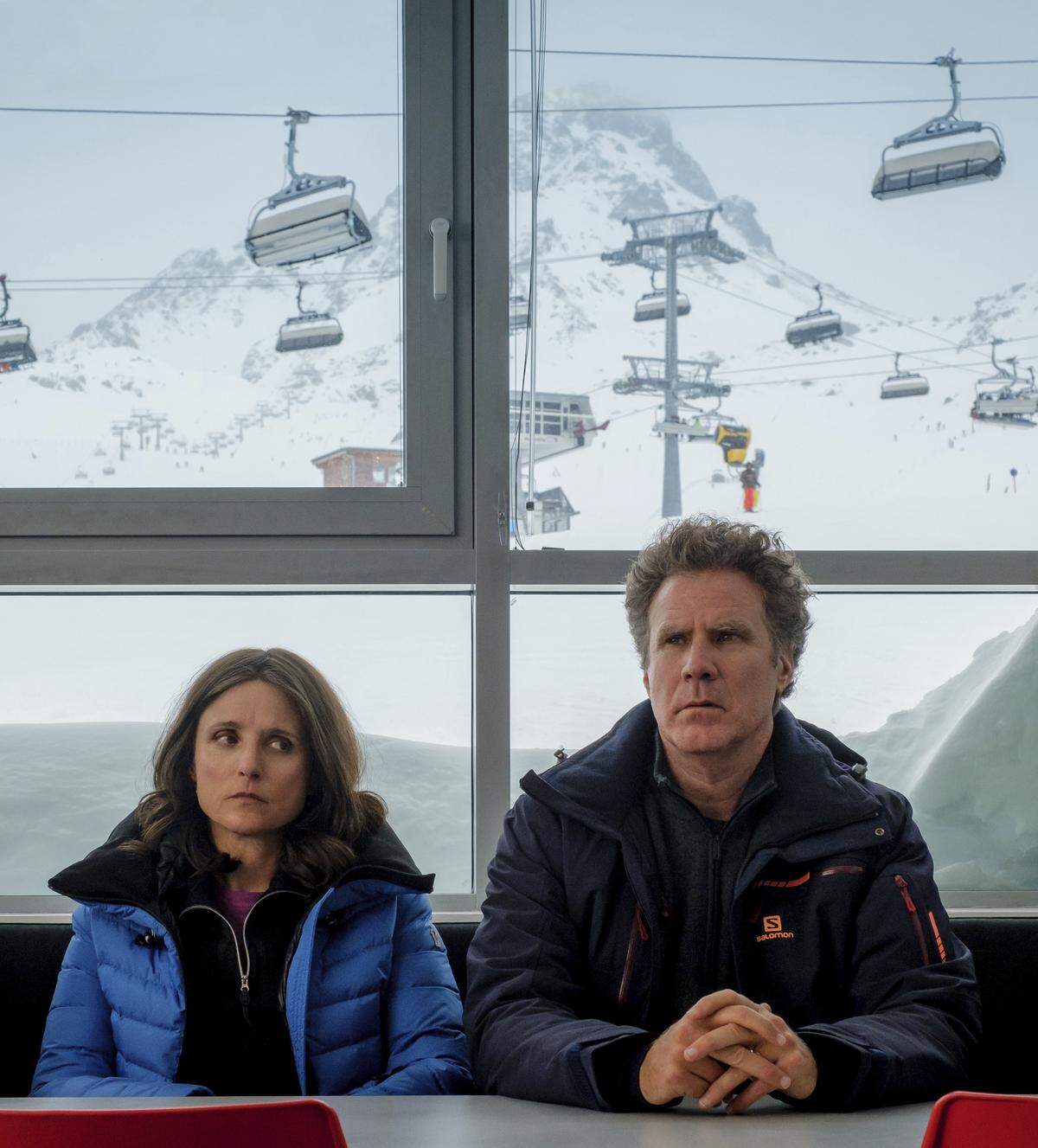 This image released by Fox Searchlight shows Julia Louis-Dreyfus, left, and Will Ferrell in a scene from “Downhill,” a remake of the Swedish film “Force Majeure.”