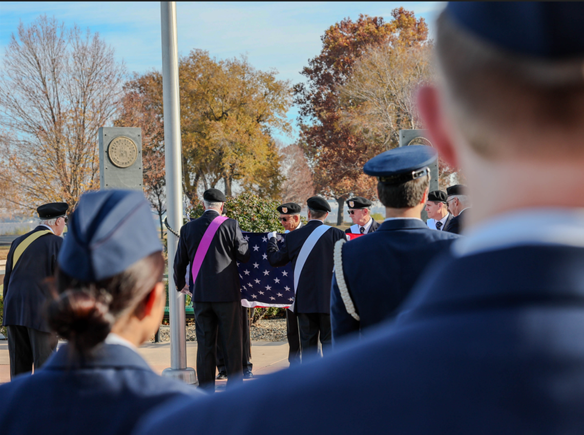 Cadets from Kennewick High School’s Air Force Junior ROTC stand at attention as members of the Knights of Columbus raise the flag.