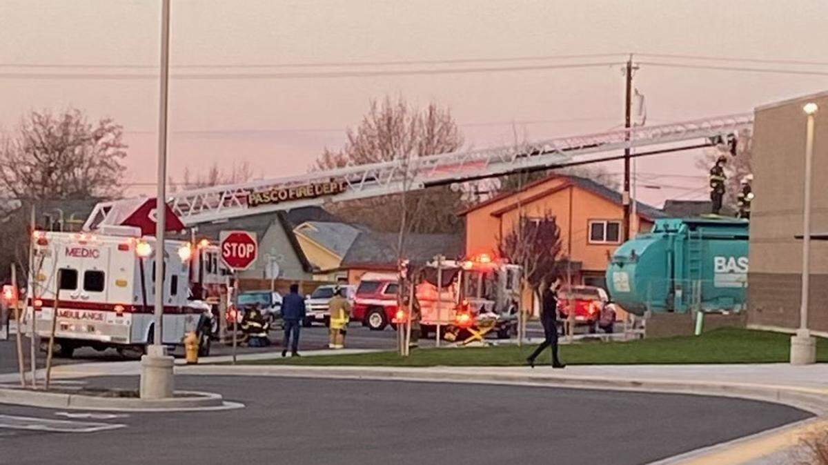 A transient was rescued from a garbage truck outside Stevens Middle School in Pasco on Friday morning.
