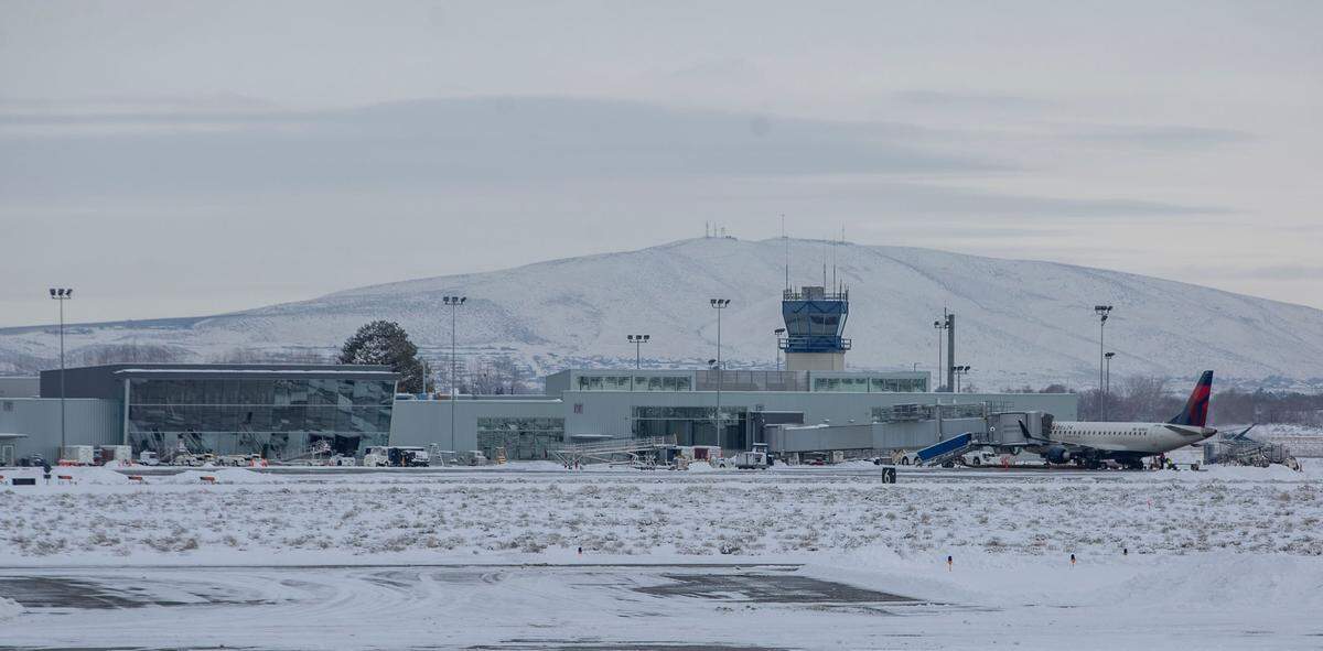 While Tri-Cities schools, Hanford, PNNL and other businesses closed Thursday following an overnight blanket of snow that covered the area, the Tri-Cities Airport in Pasco remained fully operational.