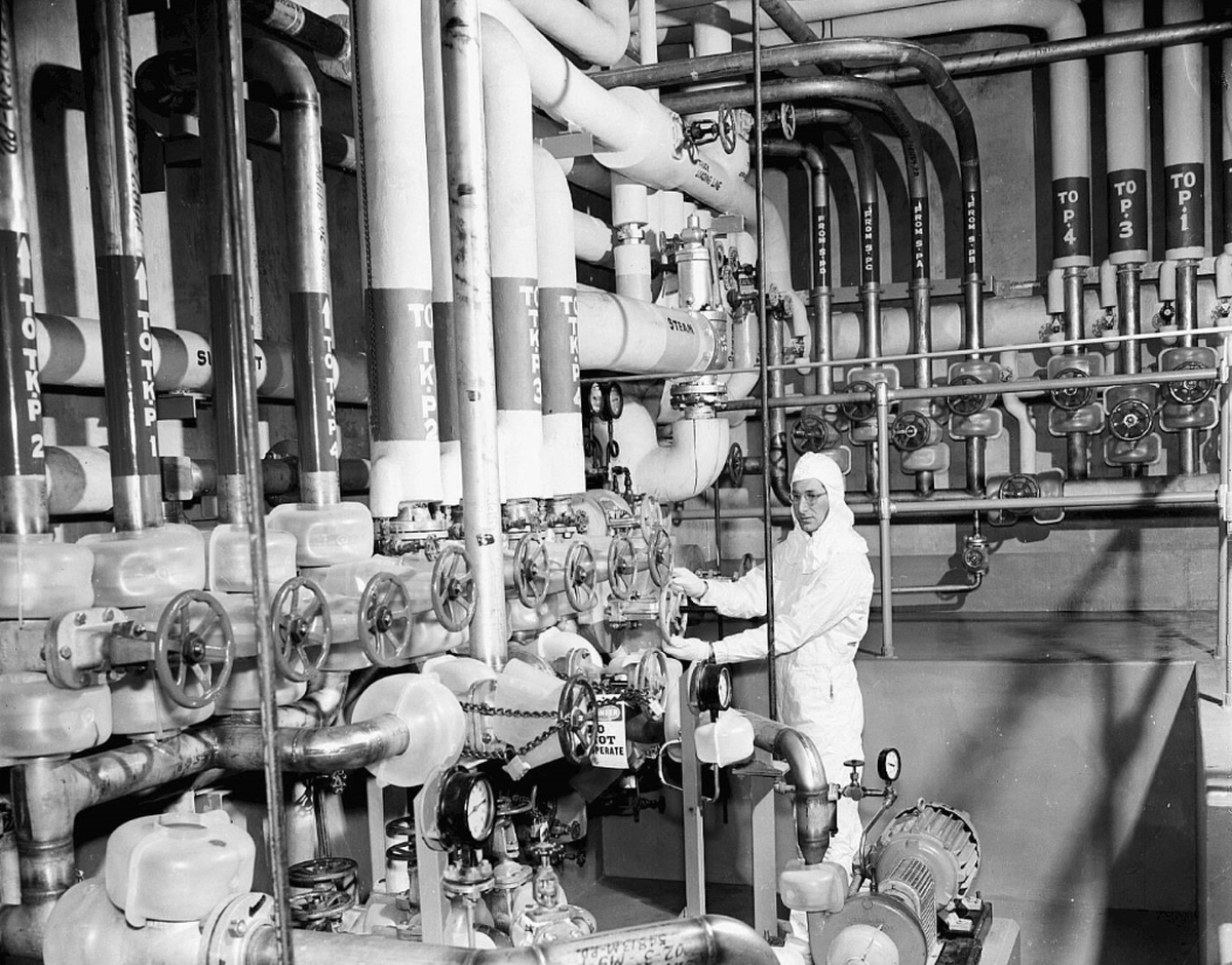 A worker is shown at the Hanford PUREX processing plant in 1956.
