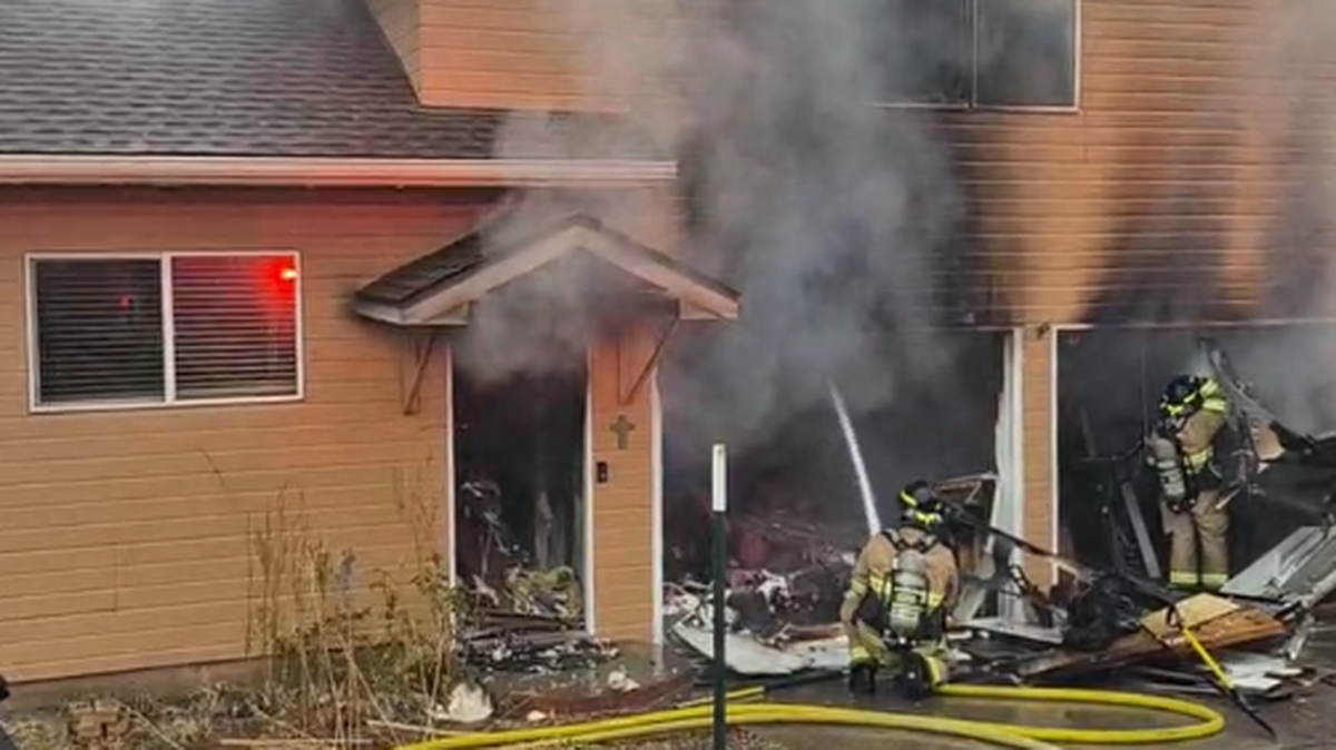 A fire started in the garage of a West Richland home and forced a husband and wife into the cold.