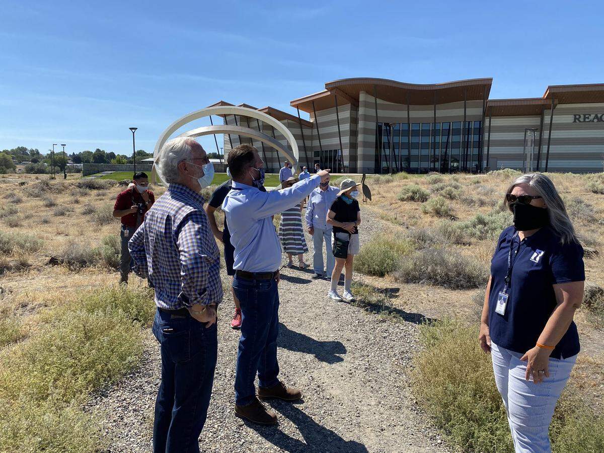 U.S. Rep. Dan Newhouse, center left, tours outside the REACH Museum in Richland and long the Columbia River shoreline.