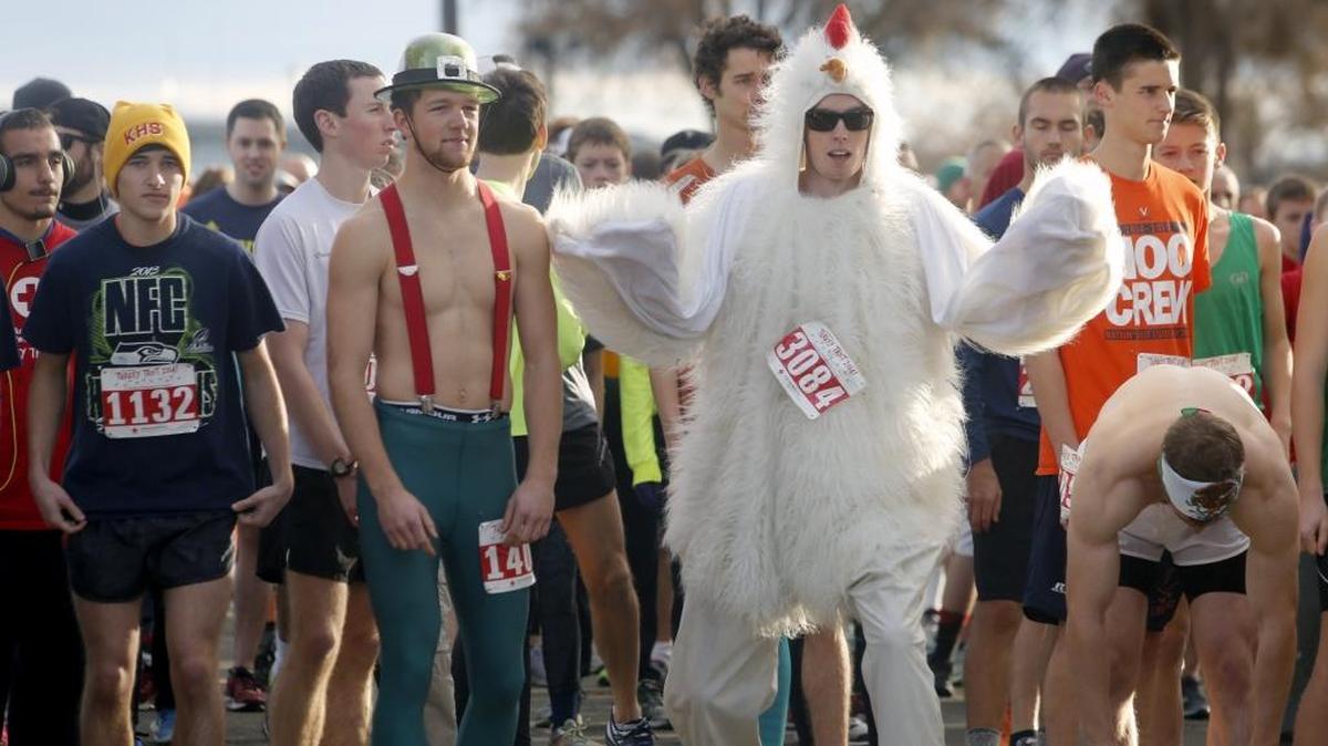 A turkey flaps its wings at the starting line of the annual Turkey Trot 5k fun run Thanksgiving morning at Columbia Park in Kennewick.