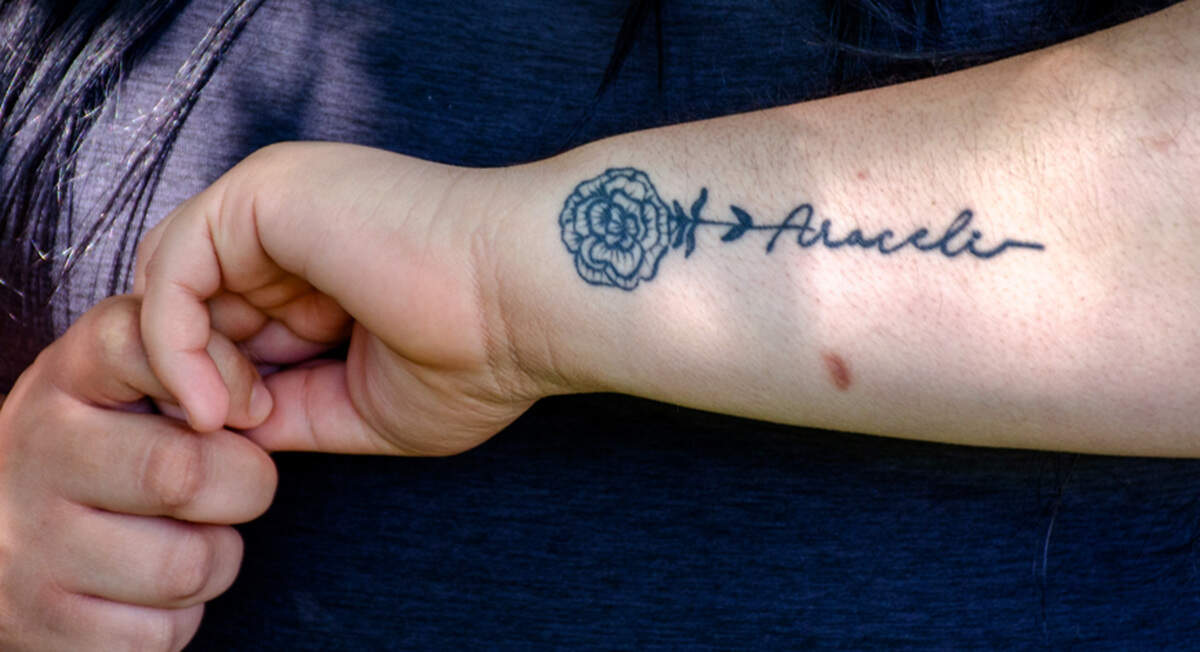 Brenda Camacho Campos, 20, of Kennewick, has a carnation tattoo with her mother’s name on it. It’s her mother’s birth month flower.