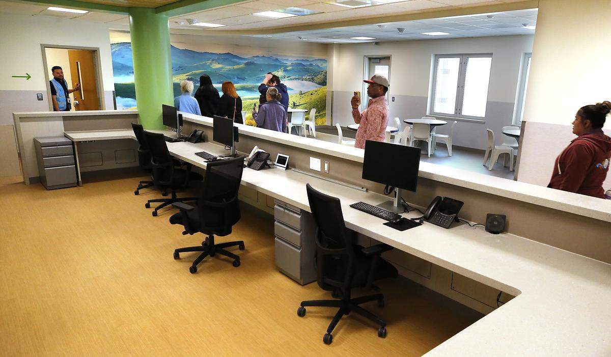 Community members take a tour through the Columbia Valley Center for Recovery during a grand opening ceremony.