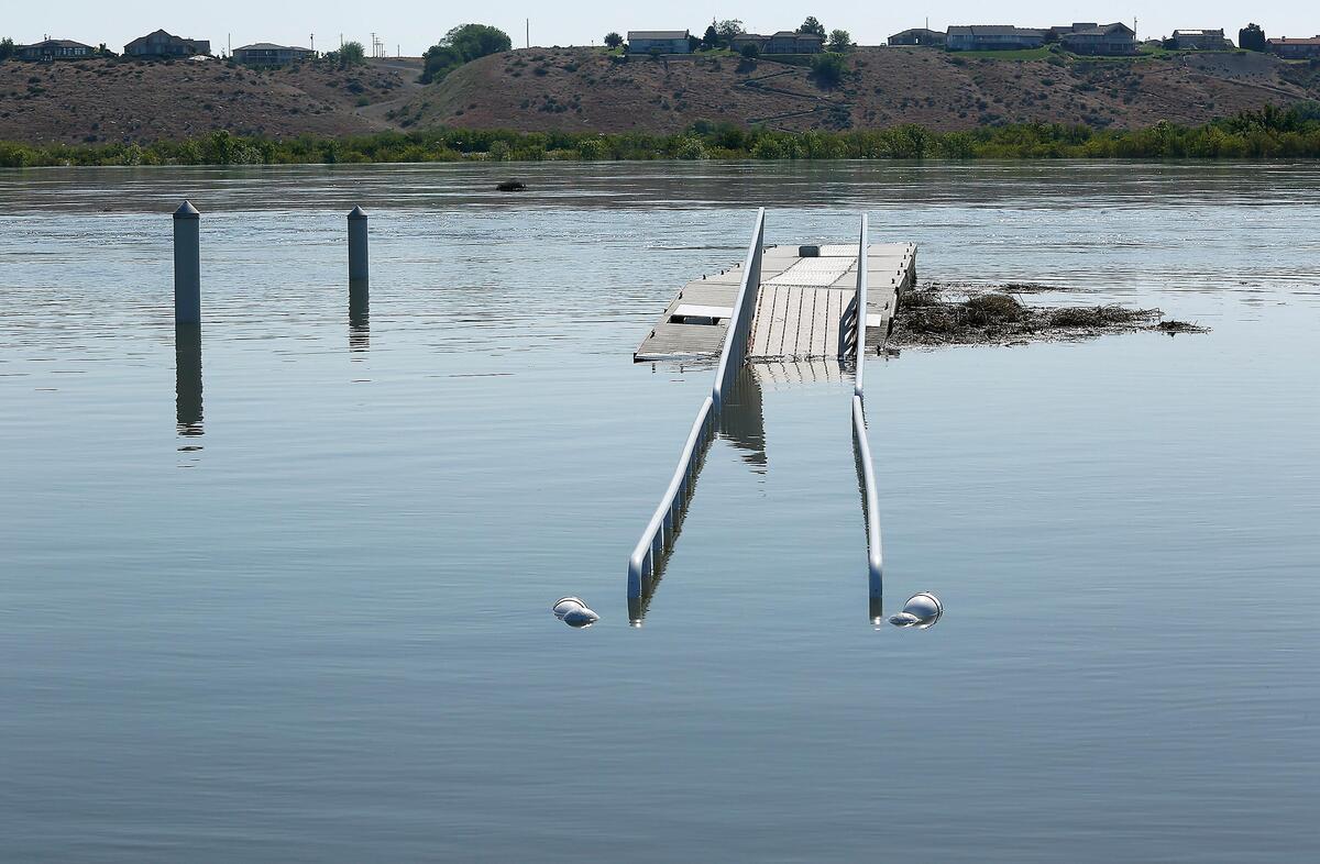 A walkway for the Snyder Street boat launch in Richland's Leslie Grove Park is partially submerged Monday as high Columbia River water flows are causing minor flooding along the Richland shoreline.