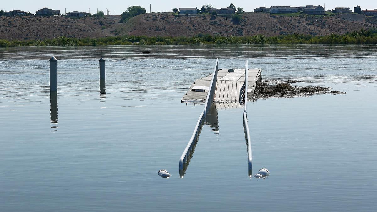 
A walkway for the Snyder Street boat launch in Richland's Leslie Grove Park is partially submerged Monday as high Columbia River water flows are causing minor flooding along the Richland shoreline.
