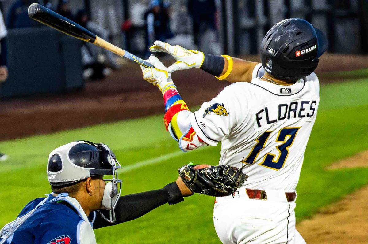 Tri-City Dust Devils baseball photos from their April 17, 2026 game against the Hillsboro Hops in Pasco. Juan Flores (13) at bat.