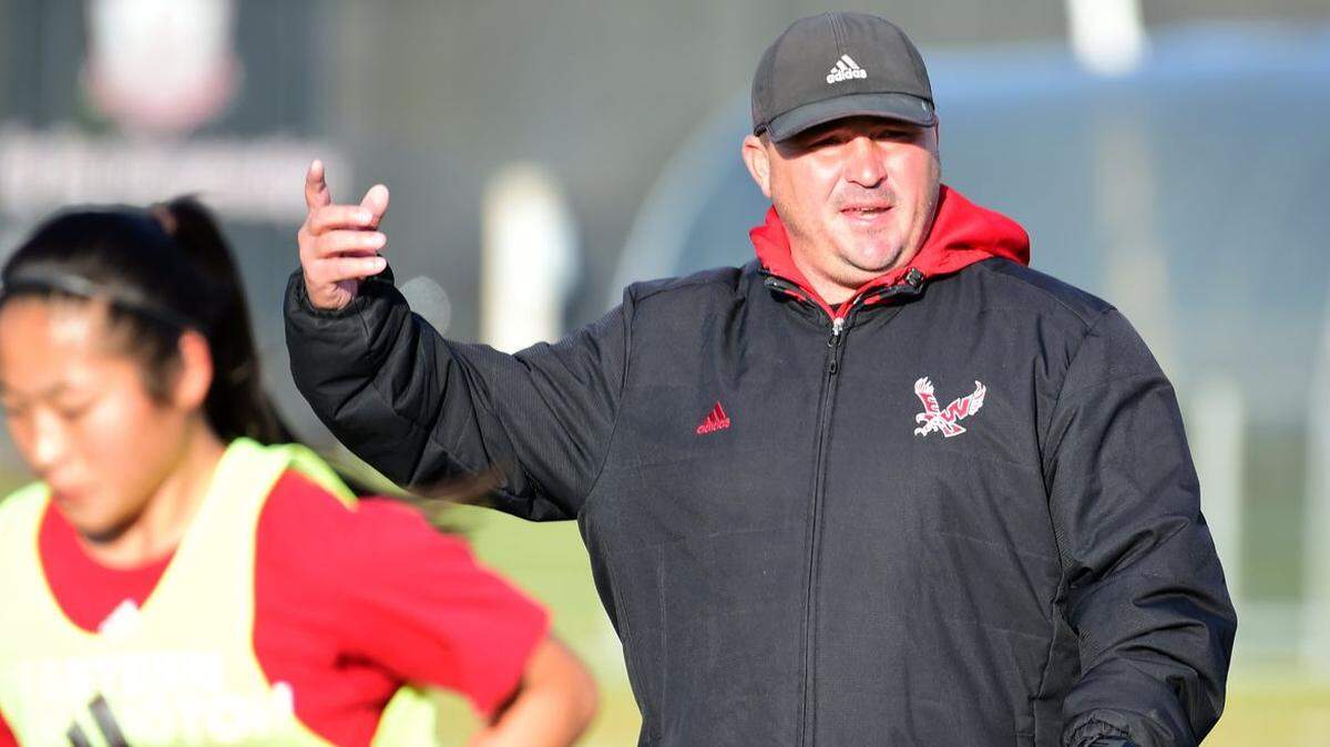 Chad Bodnar, then-head coach of the women’s soccer team at Eastern Washington University, watches players practice in October 2017.