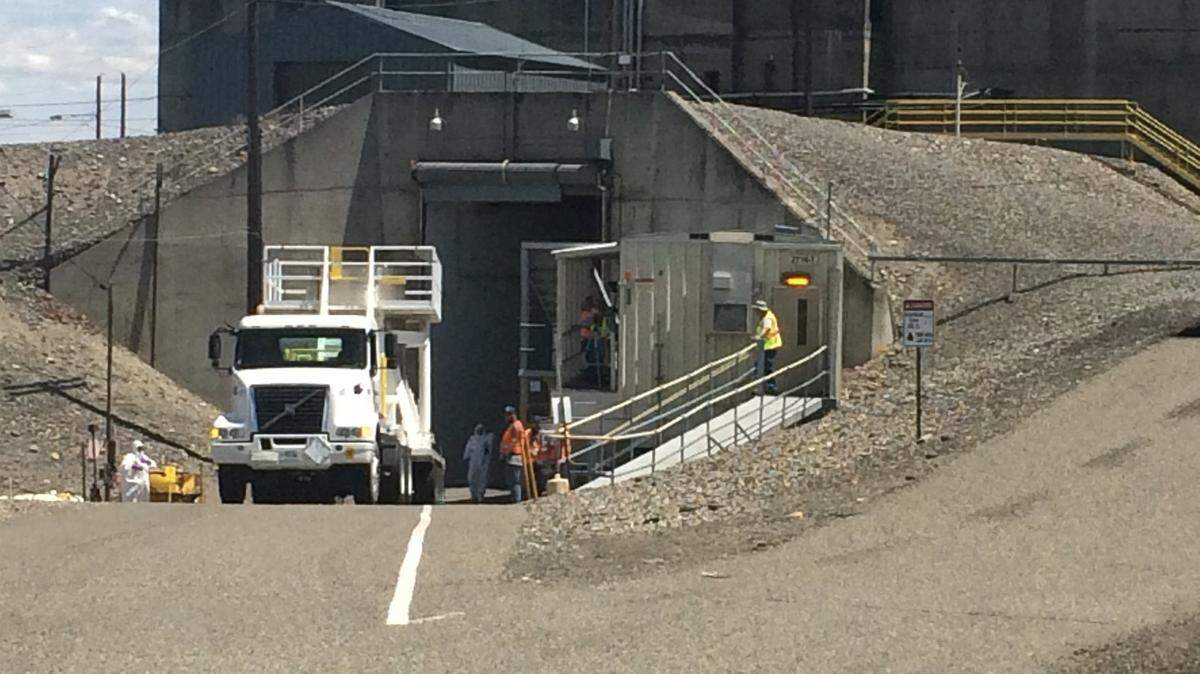 The first load of radioactive sludge arrived at Hanford’s T Plant in the center of the nuclear reservation in June 2018. The tractor trailer holding the container is shown before backing into a tunnel at the plant to allow the container to be placed in an underground cell at the plant.