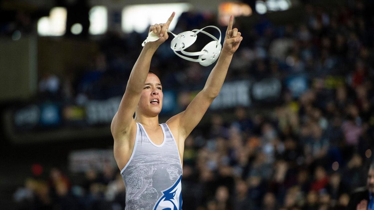 Chiawana’s Darion Johnson celebrates winning the 120-pound title Saturday during Mat Classic XXXI at the Tacoma Dome.