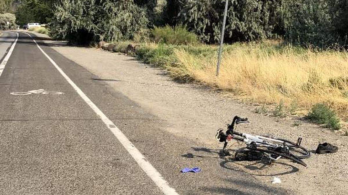 A cyclist was hit while riding through Columbia Park on Monday. The driver who hit him left the scene and was arrested later.