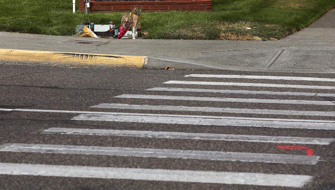 A memorial of candles and flowers were placed in August 2025 for hit-and-run victim Lorenzo Ayohua Ramos on the north side of West Clark Street near the crosswalk at North Sixth Avenue in Pasco. 