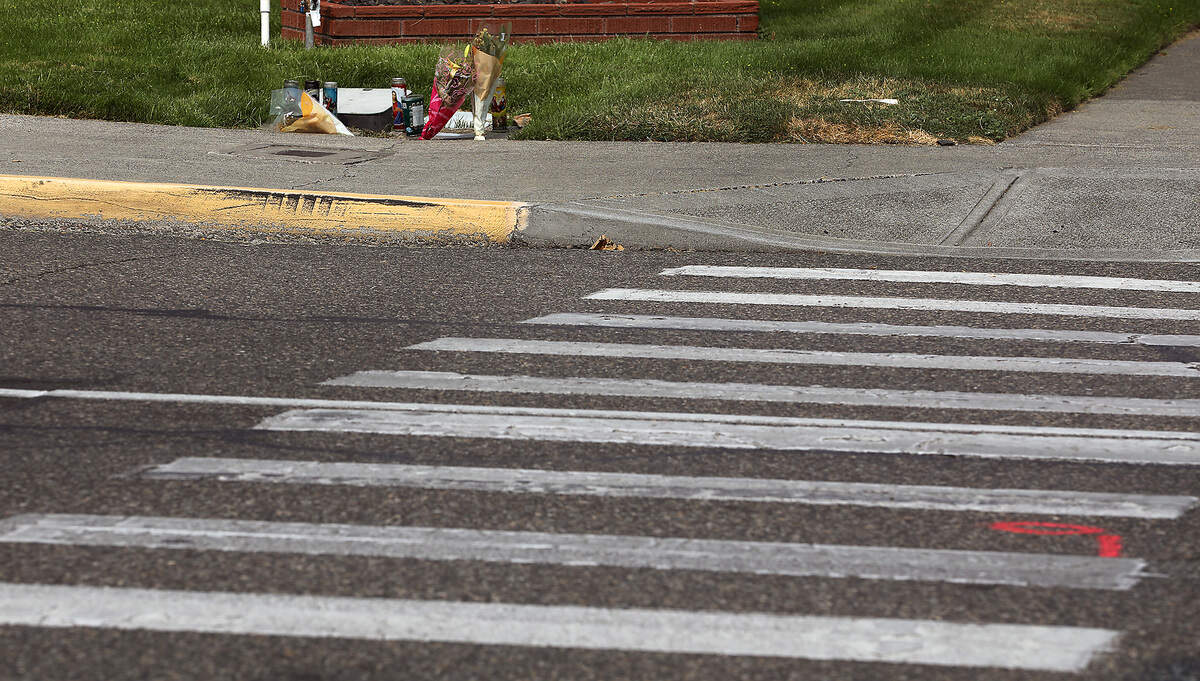 A memorial of candles and flowers were placed in August 2025 for hit-and-run victim Lorenzo Ayohua Ramos on the north side of West Clark Street near the crosswalk at North Sixth Avenue in Pasco.