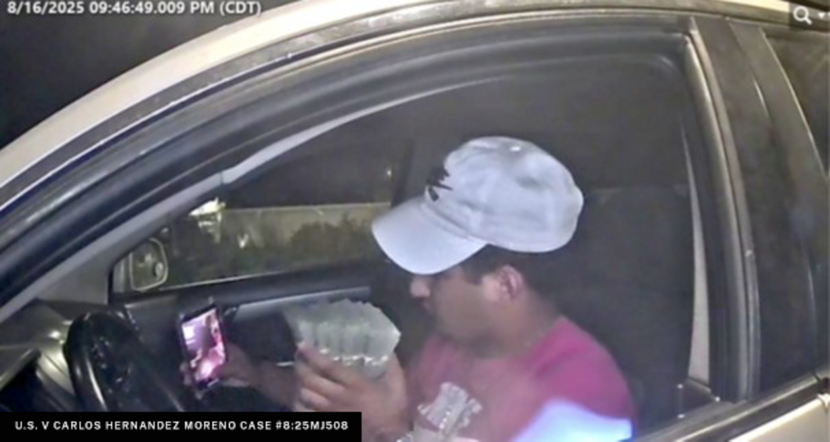 An alleged ATM jackpotting attack in progress.