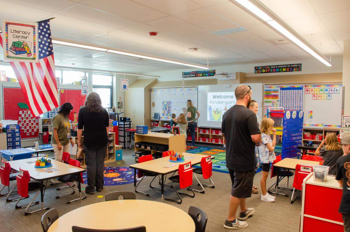 Desert Sky Elementary families get acquainted with Stacy Wertenberger’s kindergarten classroom during an open house Monday, the day before classes began.