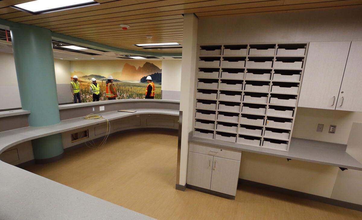 Visitors tour the Columbia Valley Center Recovery for in downtown Kennewick to see the construction progress of the facility that will offer mental health, sobering, detox and residential substance use treatment later this spring when it opens.
