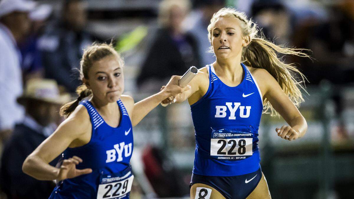 Ellie Heiden-Quackenbush (228) of Kennewick, hands off to a Brigham Young University teammate during the 4x400 relay at the West Regionals meet last month in California. Her relay team earned a spot to the NCAA Track and Field Championships this week in Oregon.