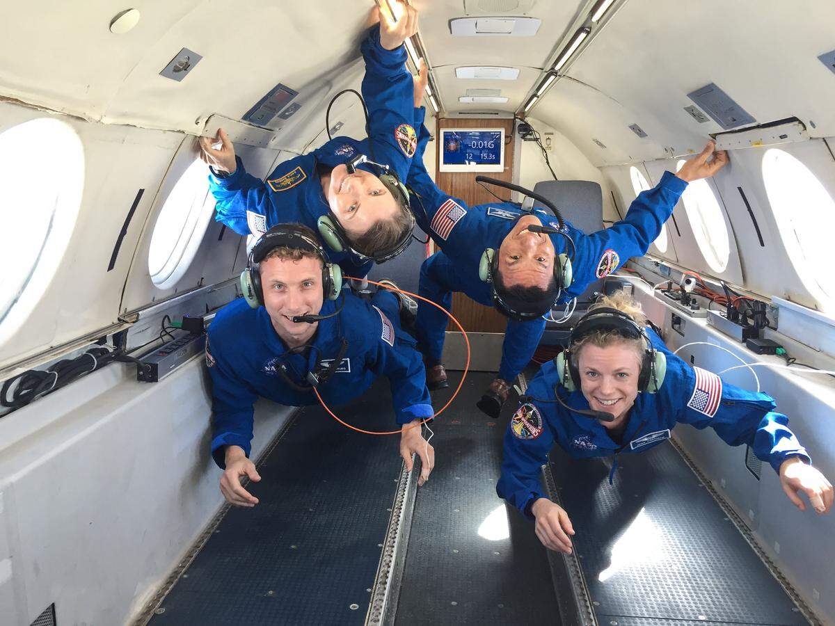NASA astronaut candidates Warren Hoburg, Kayla Barron (upper left), Frank Rubio and Zena Cardman during their reduced gravity flight aboard Canadian Space Agency’s Dassault Falcon 20 Jet.