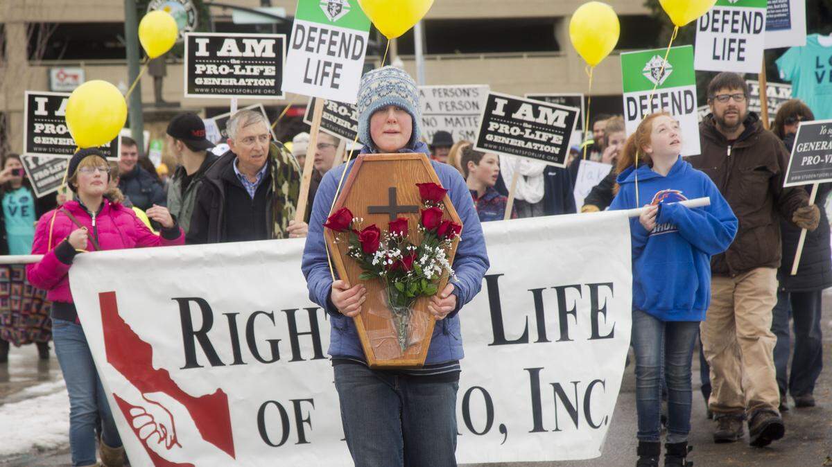 Demonstrators march in an anti-abortion rally in downtown Boise, Idaho, in 2017. Oregon is providing more abortions than its residents receive, a sign that residents of neighboring states with more restrictions, like Idaho, are crossing the border to undergo the procedure.