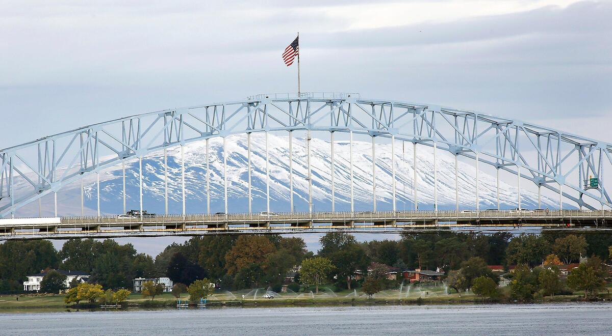 The snow covered Rattlesnake Mountain looms large behind the blue bridge Monday morning following stormy weekend weather that ushered in cold temperatures across the region. The National Weather Service has issued a freeze warning, from 2 a.m. to 10 a.m Tuesday, across the Mid-Columbia. The frost and freezing conditions has potential to kill crops, other sensitive vegetation and possibly damage unprotected outdoor plumbing, according to the warning.