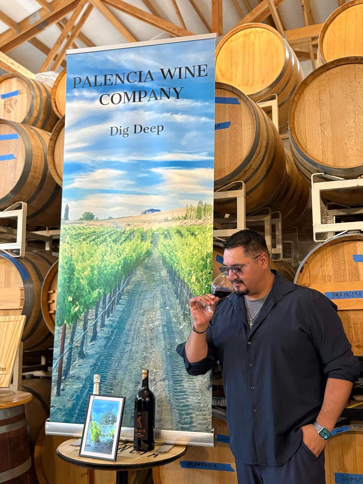 Victor Palencia, winemaker and founder of Palencia Wine Company, smells a glass of wine while in the tasting room at the Palencia Estate in Benton City.