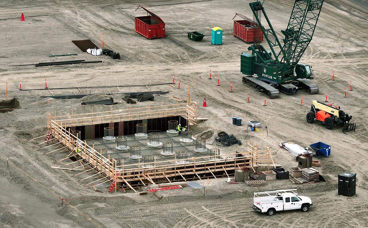 Crews work on the concrete pilings that will support the electric melter, the heart of the stone wool manufacturing process, at the new Rockwool plant in Wallula, near the Tri-Cities.