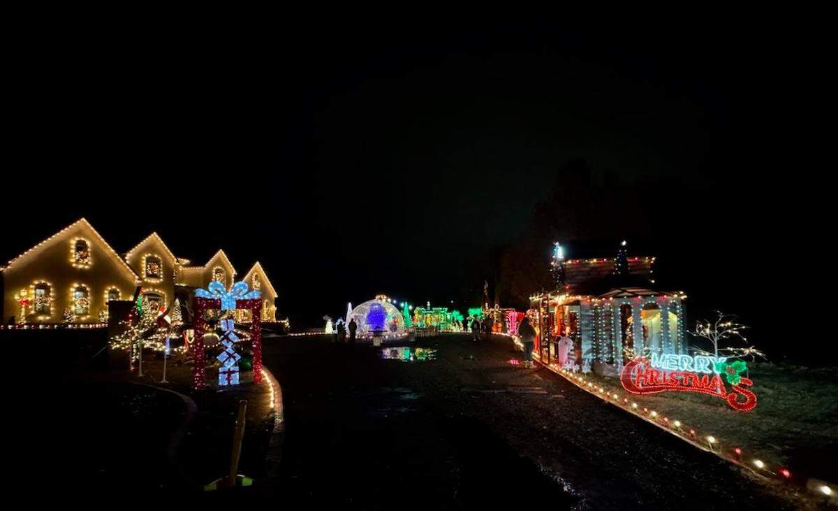 A home on Columbia Park Trail in Richland is decorated with lights, trees, small houses and holiday scenes.