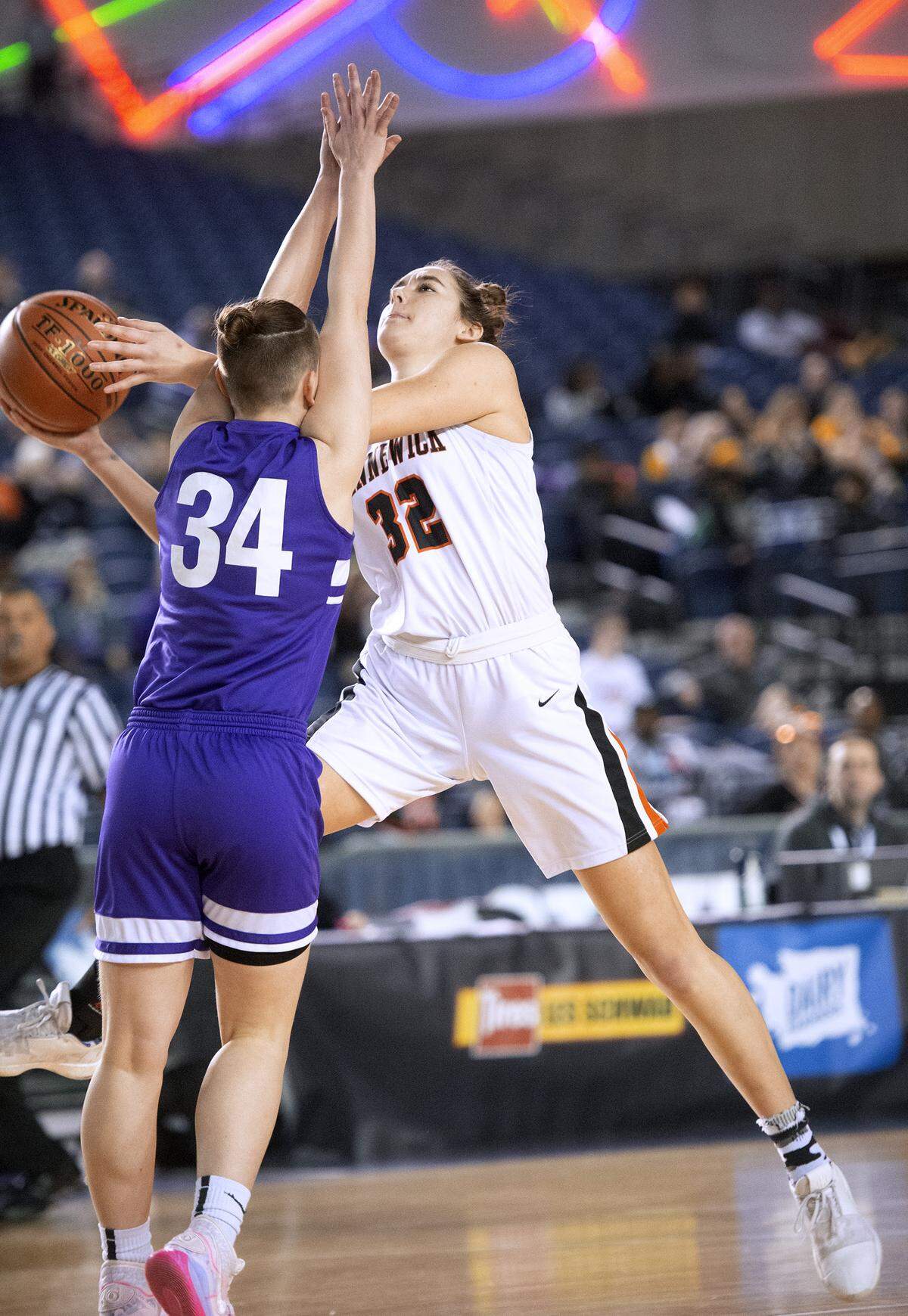 Kennewick’s Madeline Gebers drives the lane against Garfield defender Kira Wood during Wednesday night’s opening-round game of the WIAA 3A girls state basketball tournament in the Tacoma Dome on March 4, 2020.