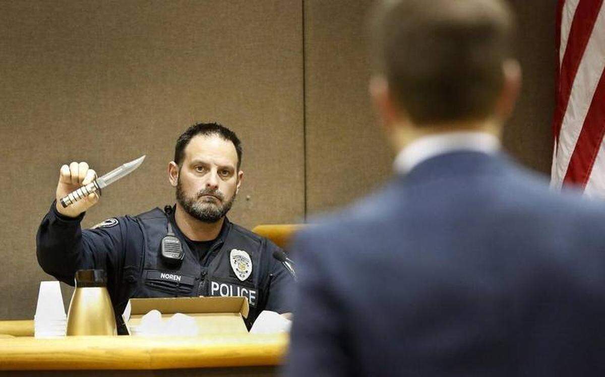 Officer Erik Noren of the Richland Police Department holds up the combat knife in March 2016 that Rory A. Star used to threaten customers in a Richland Starbucks.