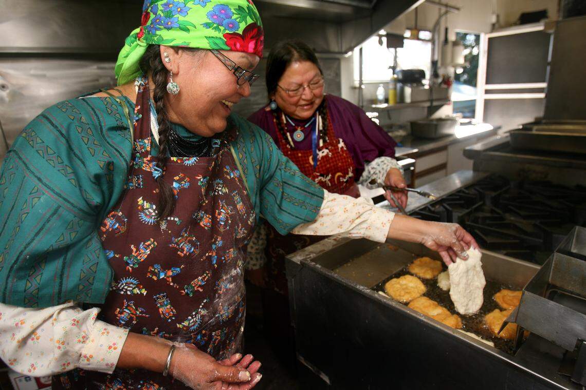 Colville tribal members Anna Jack, left, and Gloria Atkins prepare traditional fry bread.