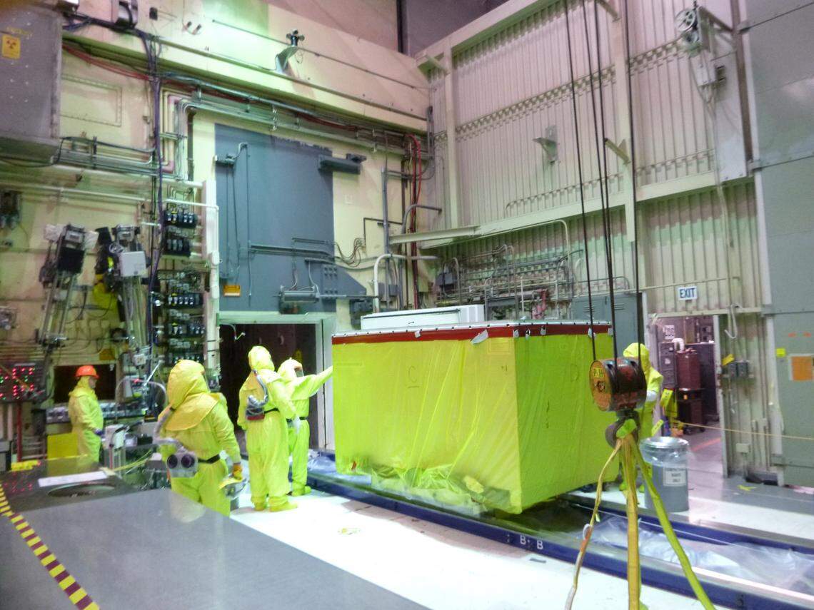 Hanford workers recently removed a large waste box at the 324 Building for disposal. Preparations are underway to remove soil contaminated with high level radioactive waste from beneath the building.