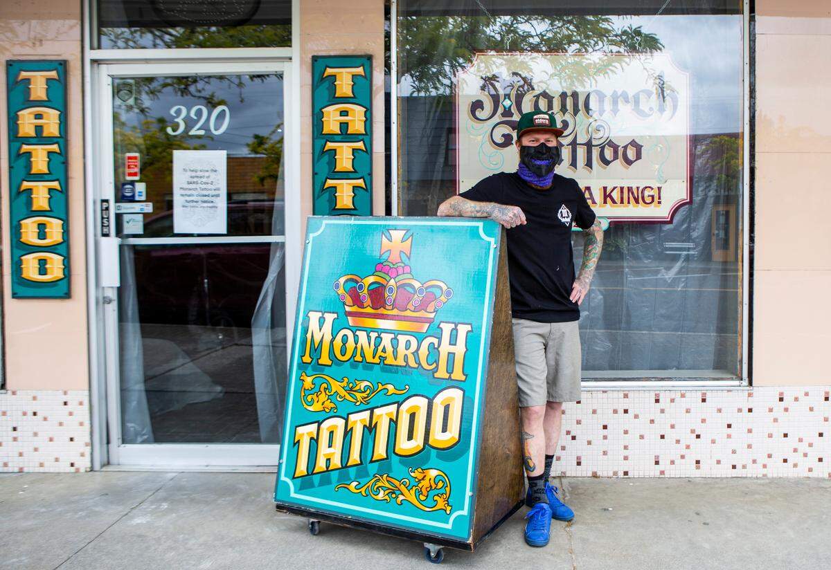 Tattoo artist Kody Flannery, 34, stands outside of Monarch Tattoo which he has worked at since 2010 and been the sole proprietor of since 2018.