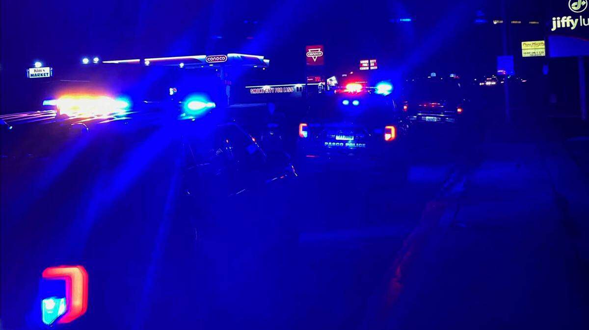 Police vehicles block West Court Street near North 19th Avenue in Pasco Thursday night after locating assault suspect Isaac Leal-Valdez in a dark colored SUV.