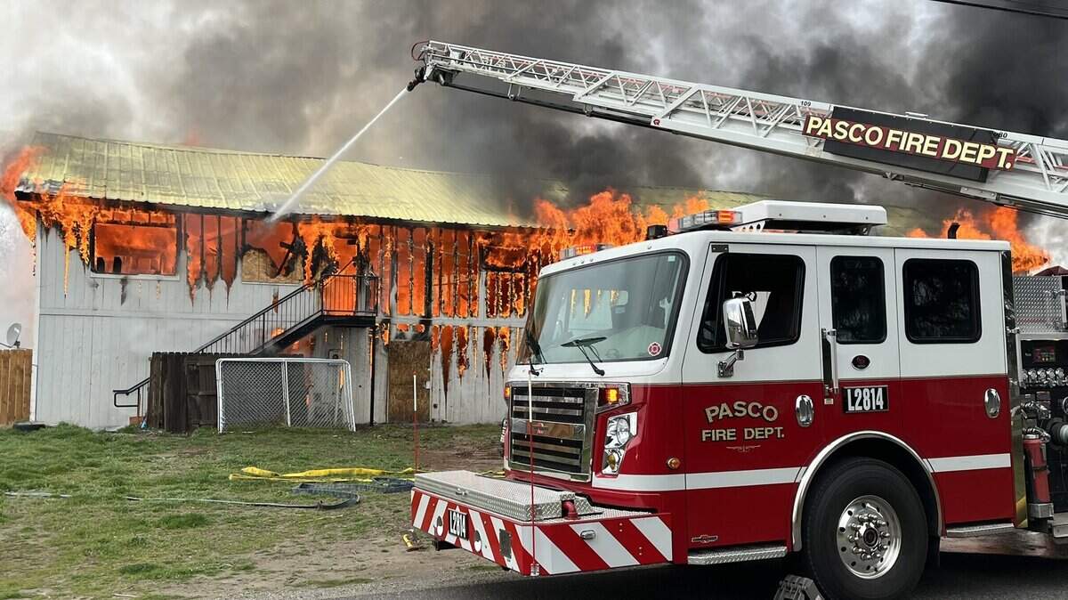 A fire engulfs a home and shop on Road 56 in this March 2022 file photo.