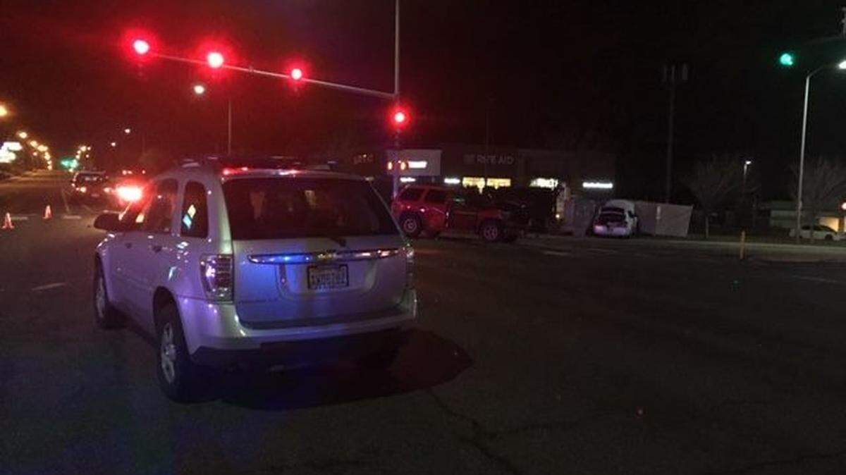 A woman behind the wheel of a silver SUV tried driving through an accident scene at the corner of Gage Boulevard and Steptoe Street Wednesday night.