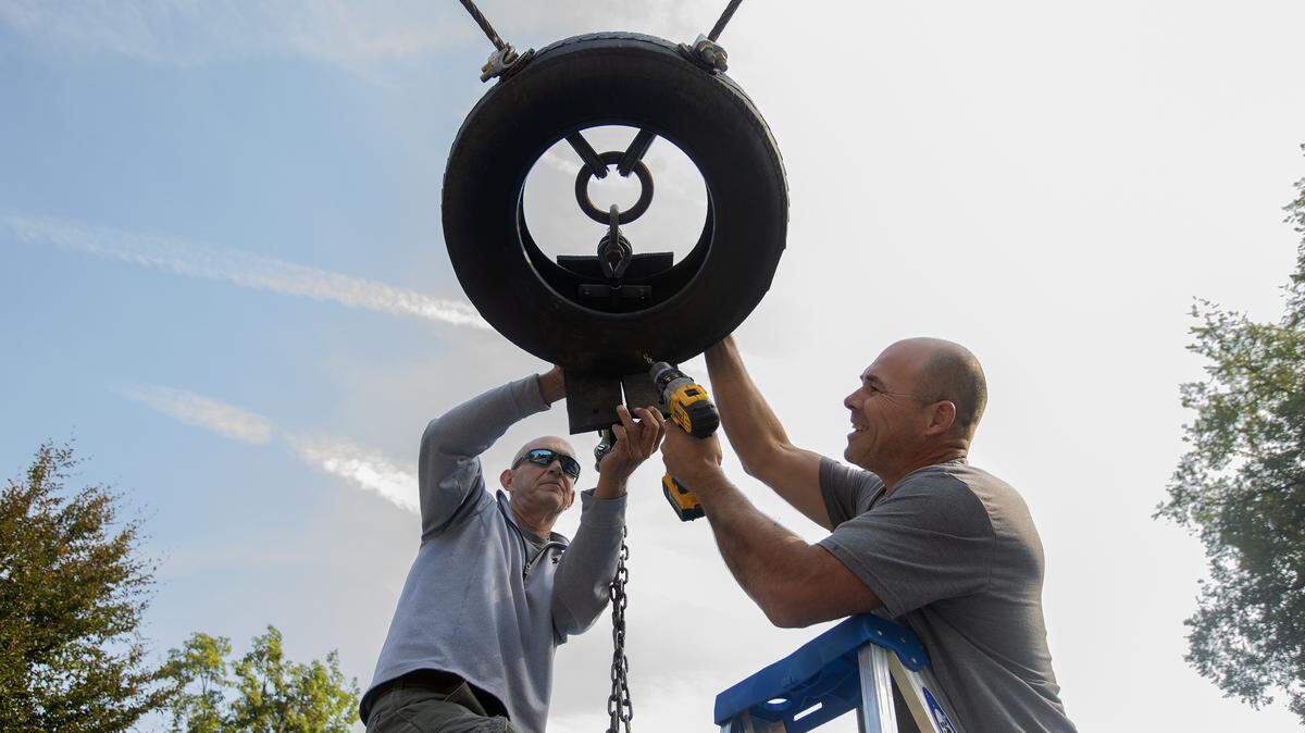 Richland parks employees Jim Hedges, left, and Nic Schmidt work on repairing the swing zipline at Howard Amon Park in Richland on Wednesday. The popular park attraction needed minor maintenance and is back in the swing of things.