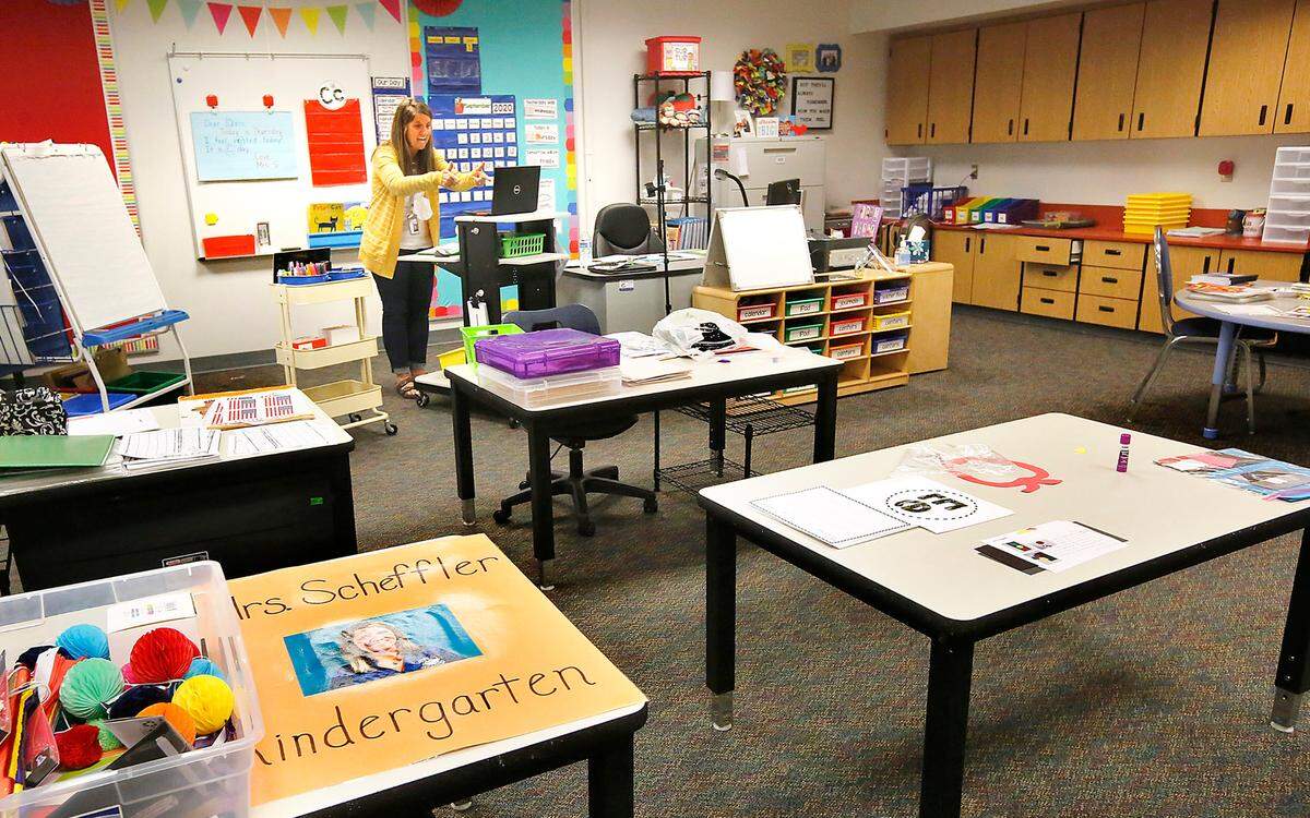 Kindergarten teacher Kathy Scheffler conducts an energetic online video class session with her students from her empty classroom at Captain Gray STEM Elementary School in Pasco during the coronavirus pandemic.