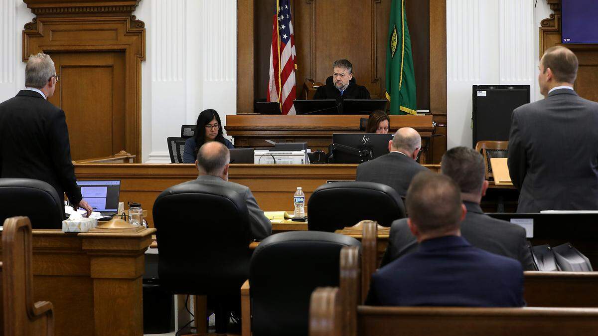 Superior Court Judge Brandon Johnson listens to motions by Benton County attorney Andrew Cooley, left, and plaintiff attorney Eron Cannon Thursday morning in a Walla Walla courtroom. A jury is being asked to decide whether a group of Benton County sheriff's deputies and command staff they should be paid for the retaliatory conduct of ex-Sheriff Jerry Hatcher.