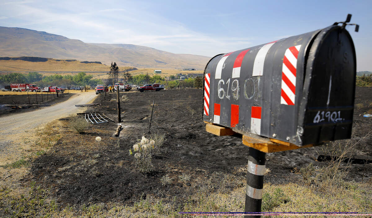 Firefighters worked to distinguish hot spots at 61901 Old Inland Empire Highway in Benton County.
