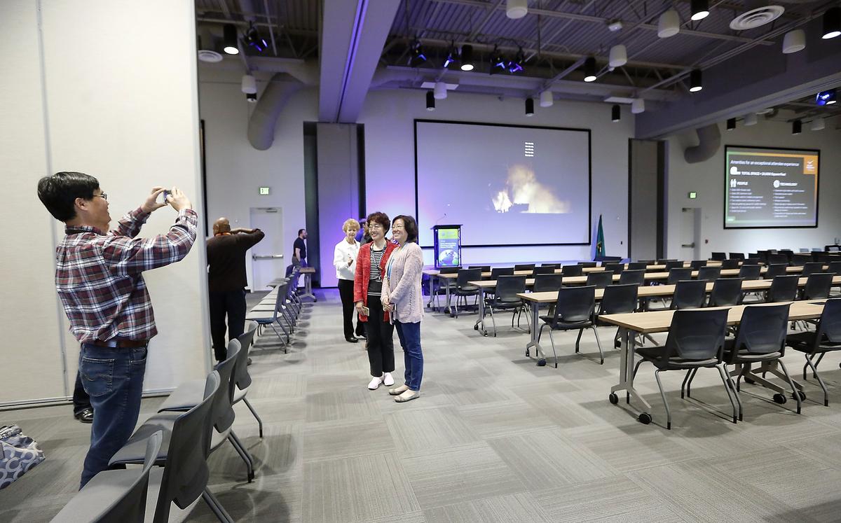 Pacific Northwest National Laboratory employees and other visitors pause for photos during a tour when Discovery Hall opened.