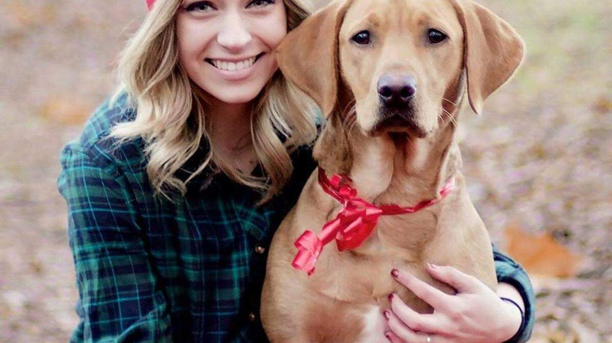 Cassidy Almquist poses with her red fox Labrador, a gift after her 2013 accident. "I have my dog, Hope, as a constant reminder that when times are tough, I can put my hope and trust in God," said Cassidy.